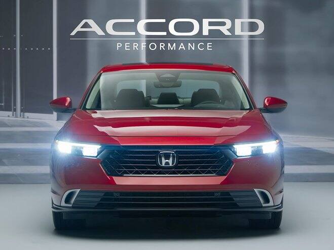 Rear shot of 2026 Honda Accord front view in Radiant Red Metallic showing LED lights on.