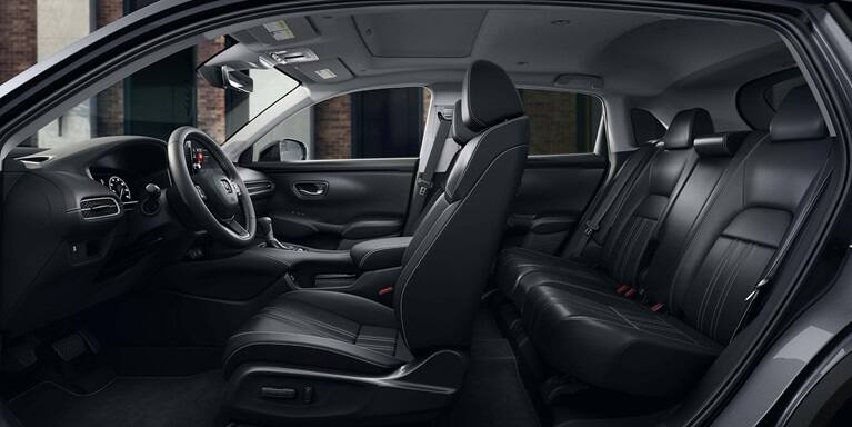 2027 Honda HR-V EX-L side view of the front and rear black leather seats and dashboard (Subcompact Crossover SUV).